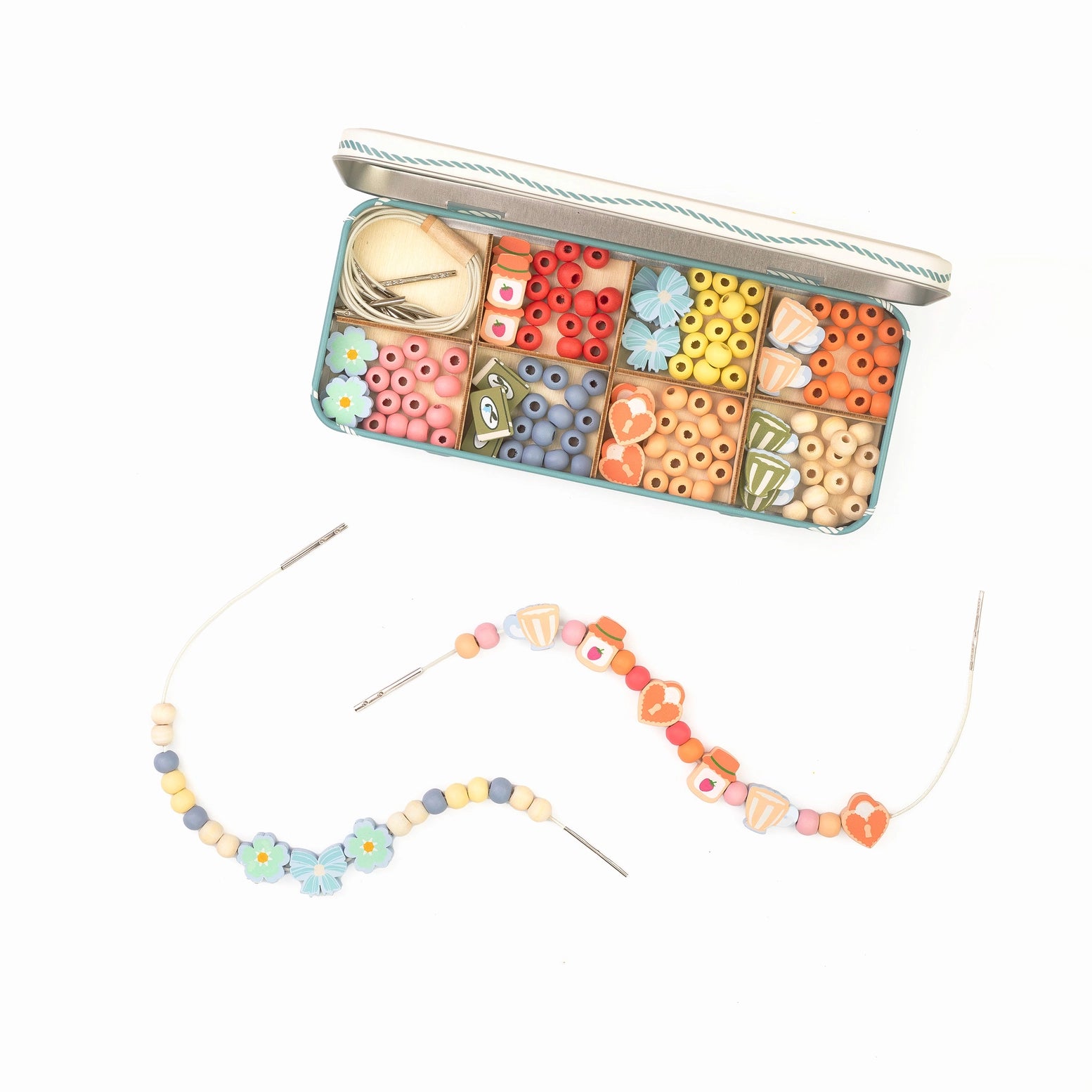 Colorful bead set with tools in a tin and a partially completed necklace on a white background