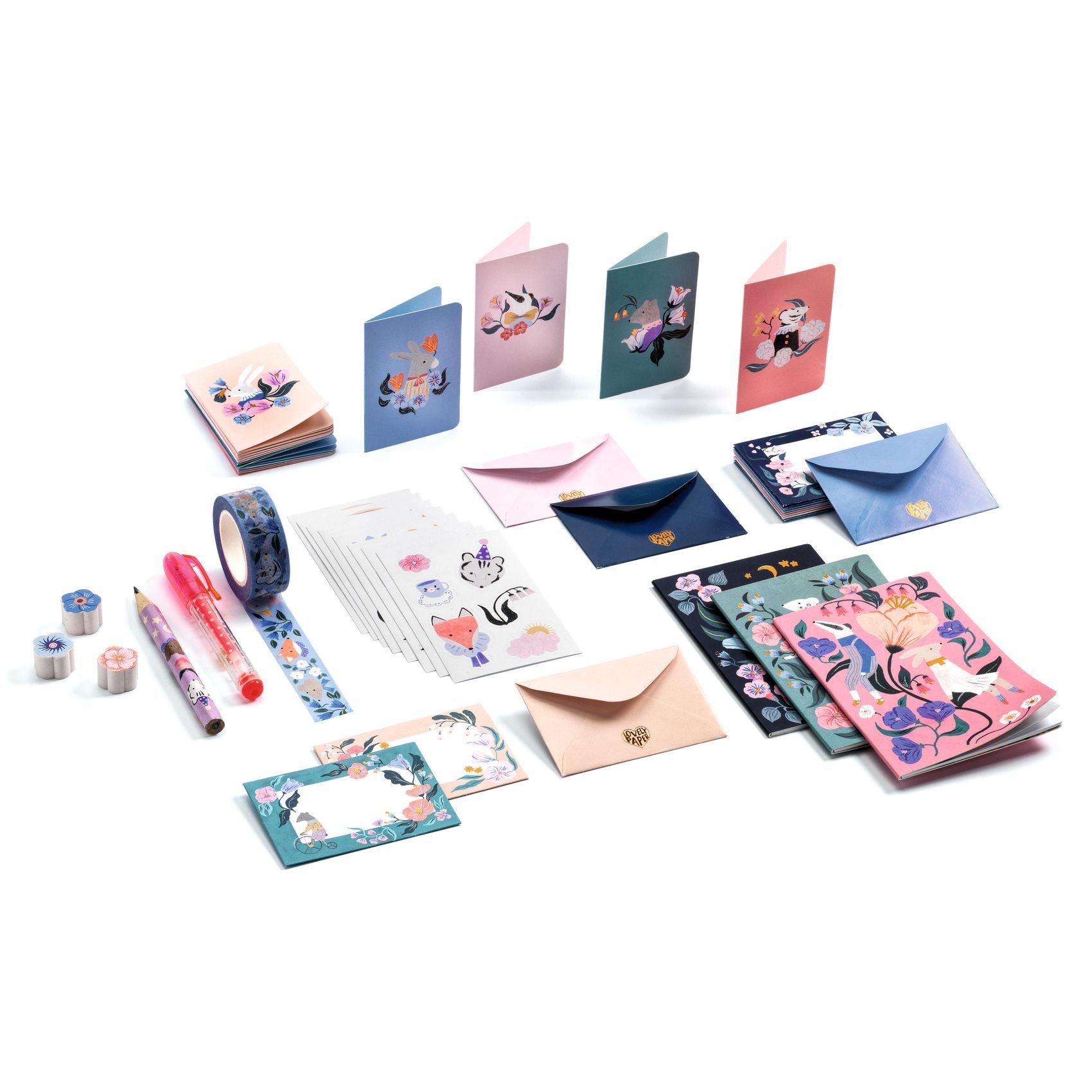 Collection of stationery items including notebooks, envelopes, and stationery on a white background