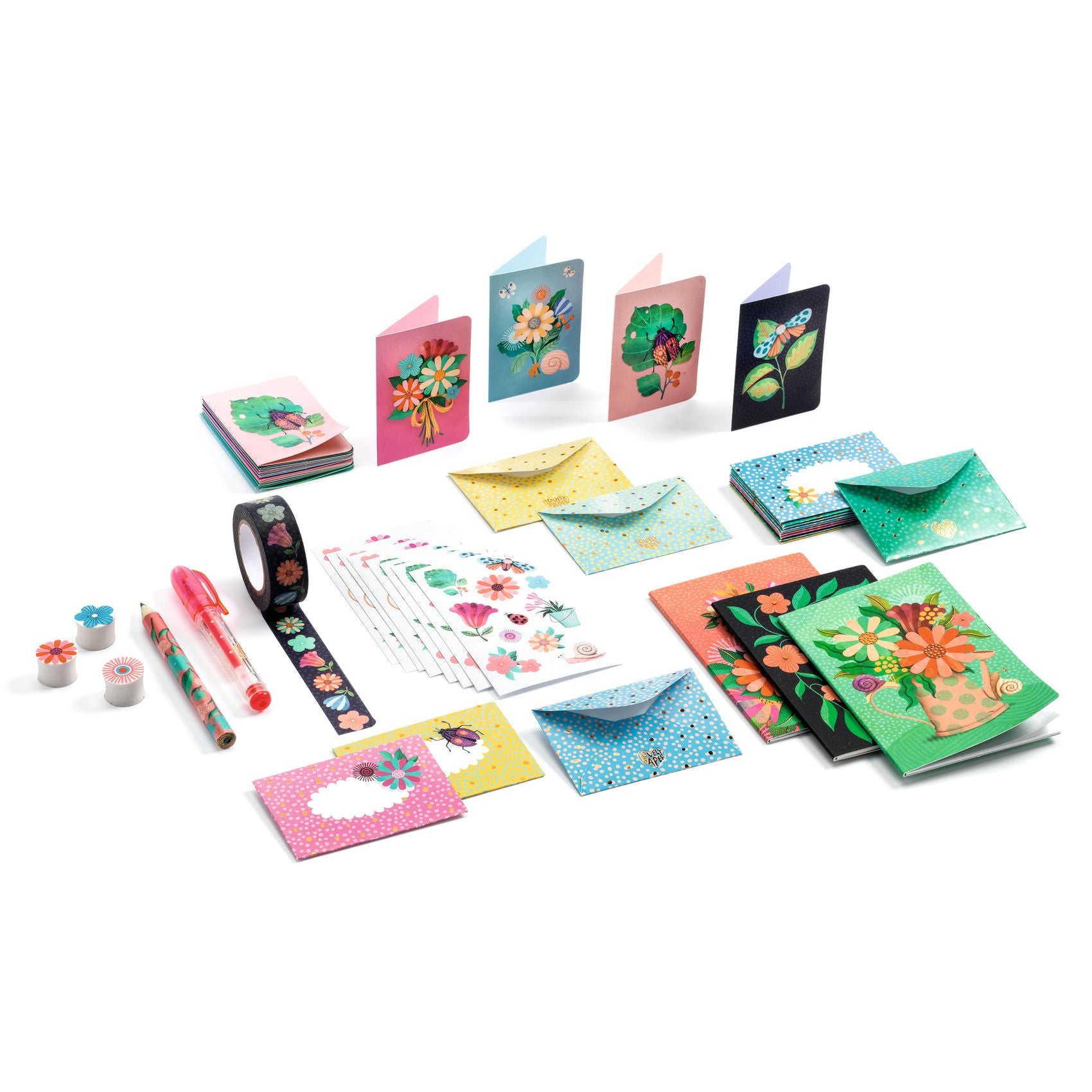 Set of colorful stationery items including cards, envelopes, note books, tape and pens on a white background