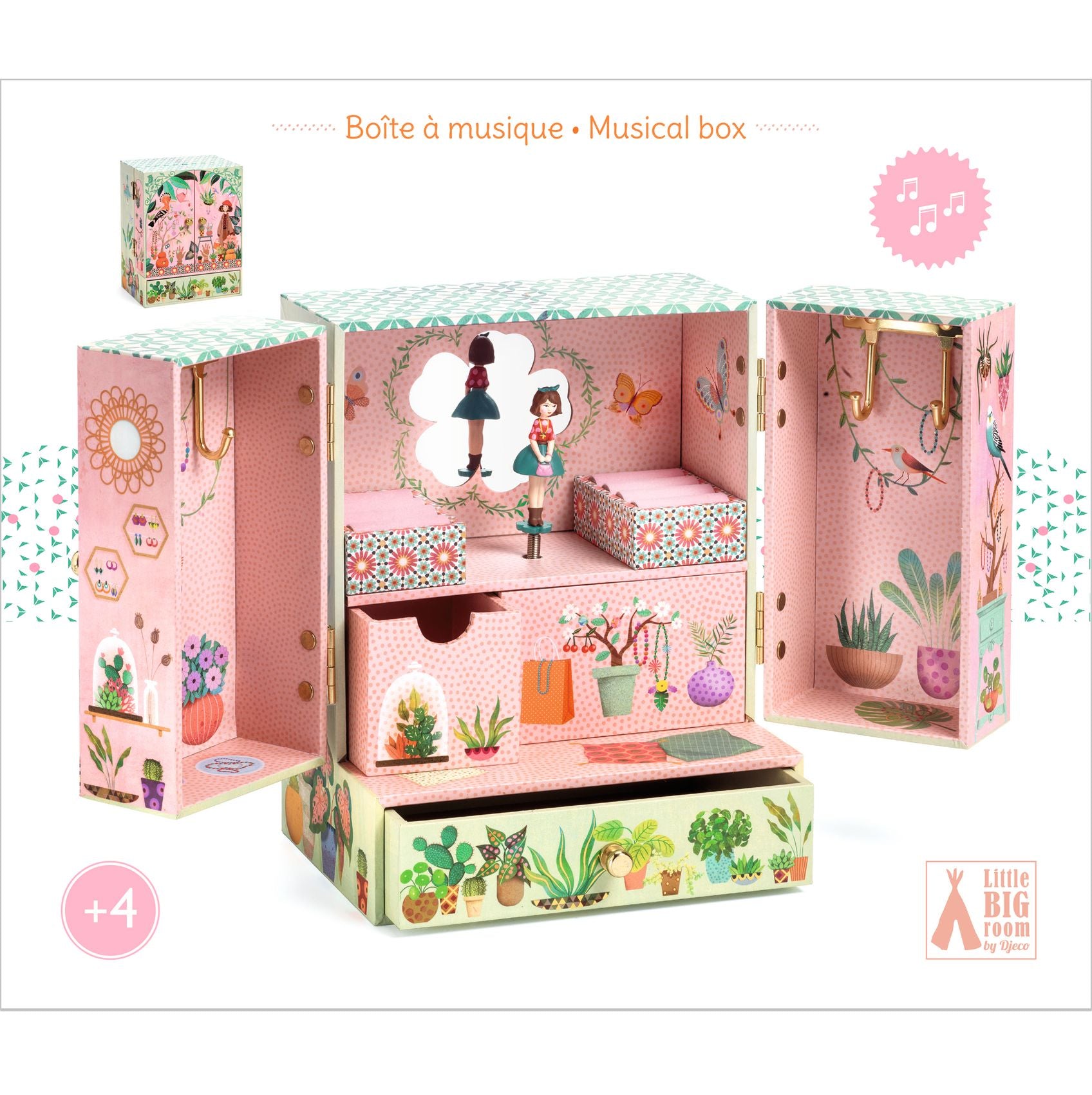 Pink musical box with floral and nature-themed design, featuring a small figure and plants.