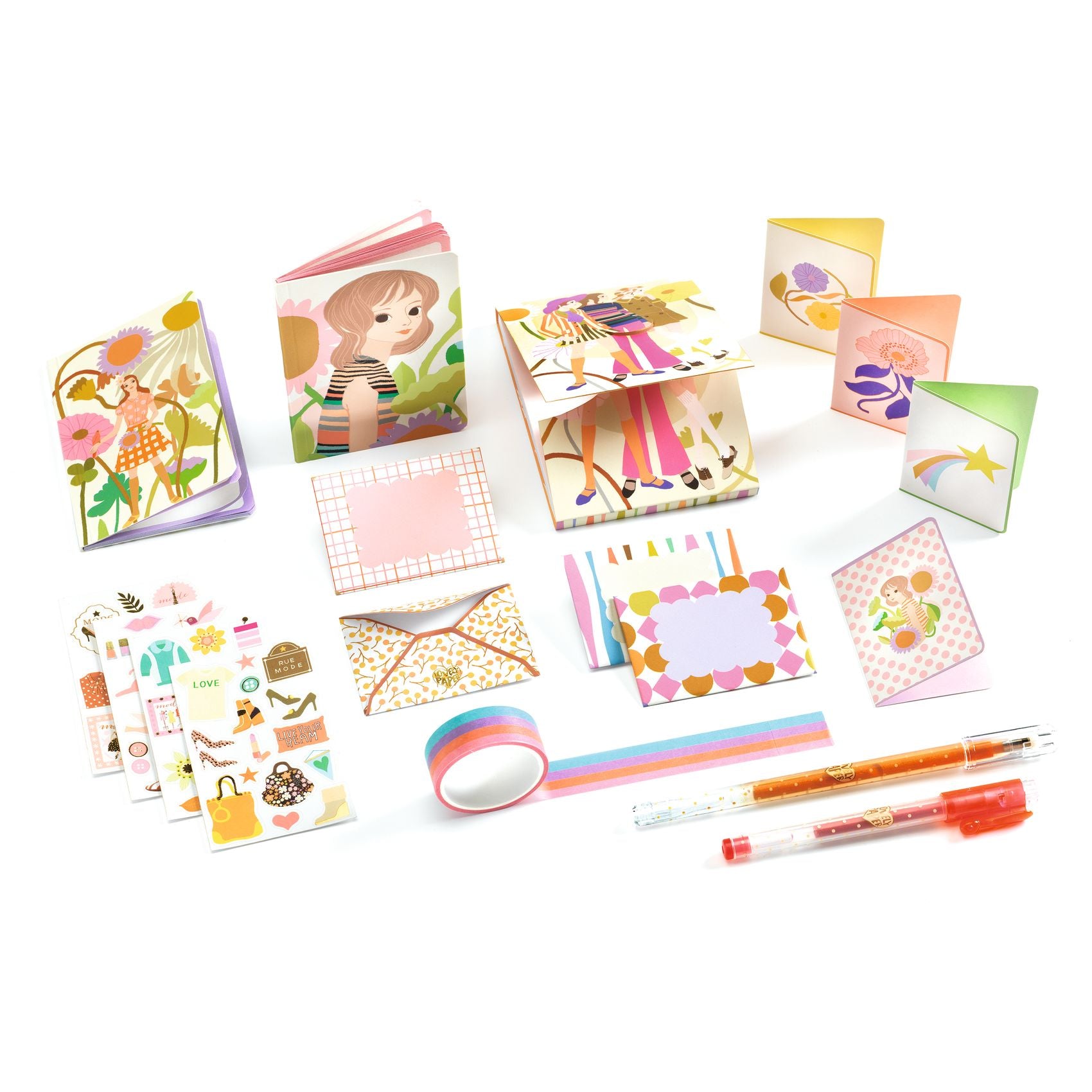 Collection of stationery items including notebooks, stickers, and pens on a white background