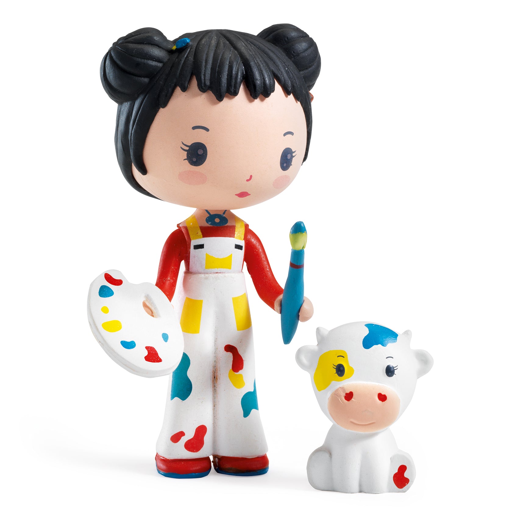 Toy figure of an artist with a cow, on a white background