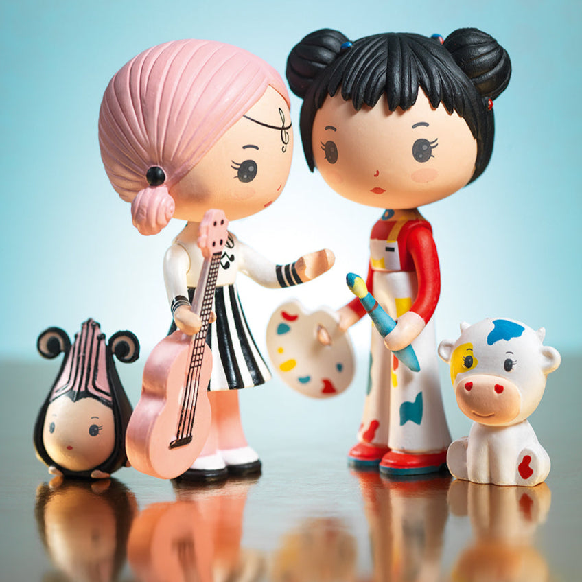 Two stylized figurines with a blue background