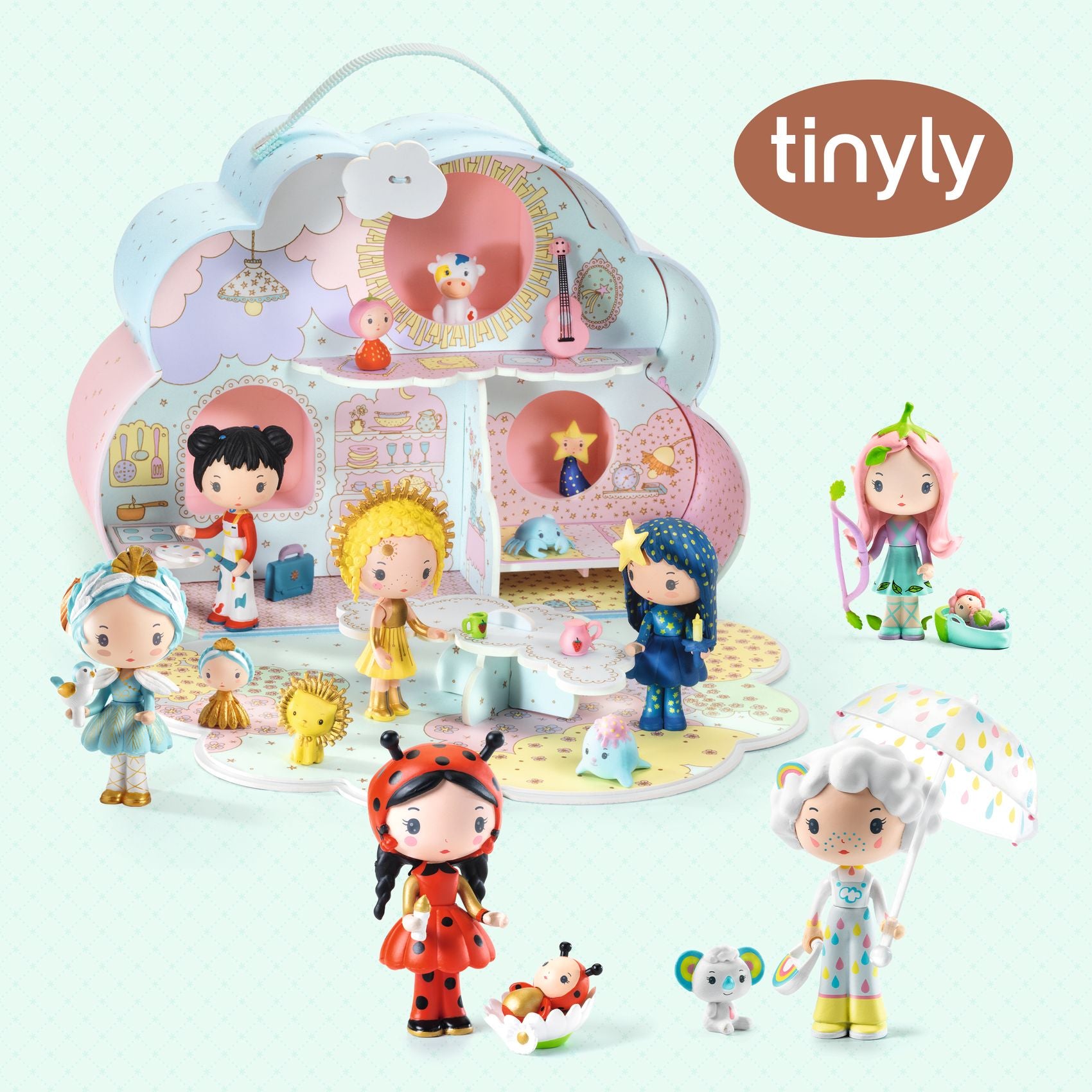 Collection of tinyly figurines with a playset on a light blue background