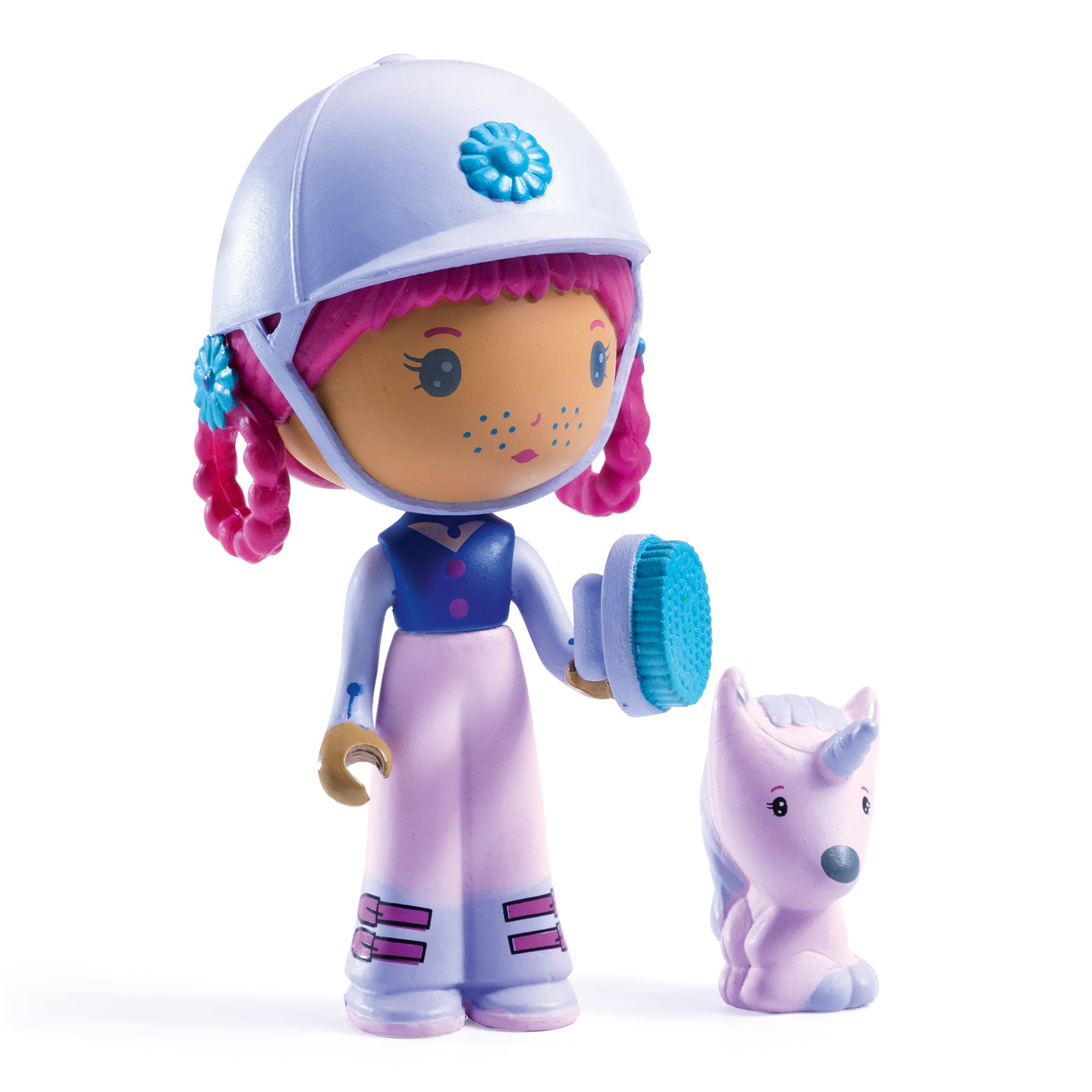 Toy figure with helmet and pink hair next to a small unicorn-like creature on a white background