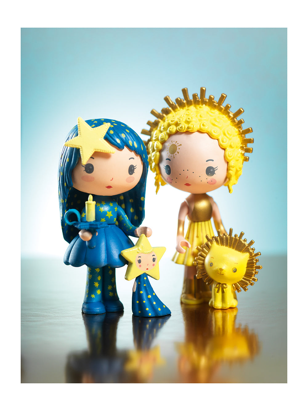 Two stylized figures, one in blue with a star and the other in gold with a lion, against a light blue background.