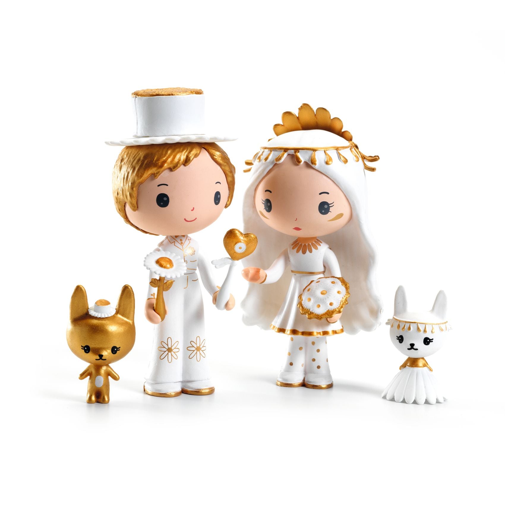 Two figurines in wedding attire with two small animal figures on a white background