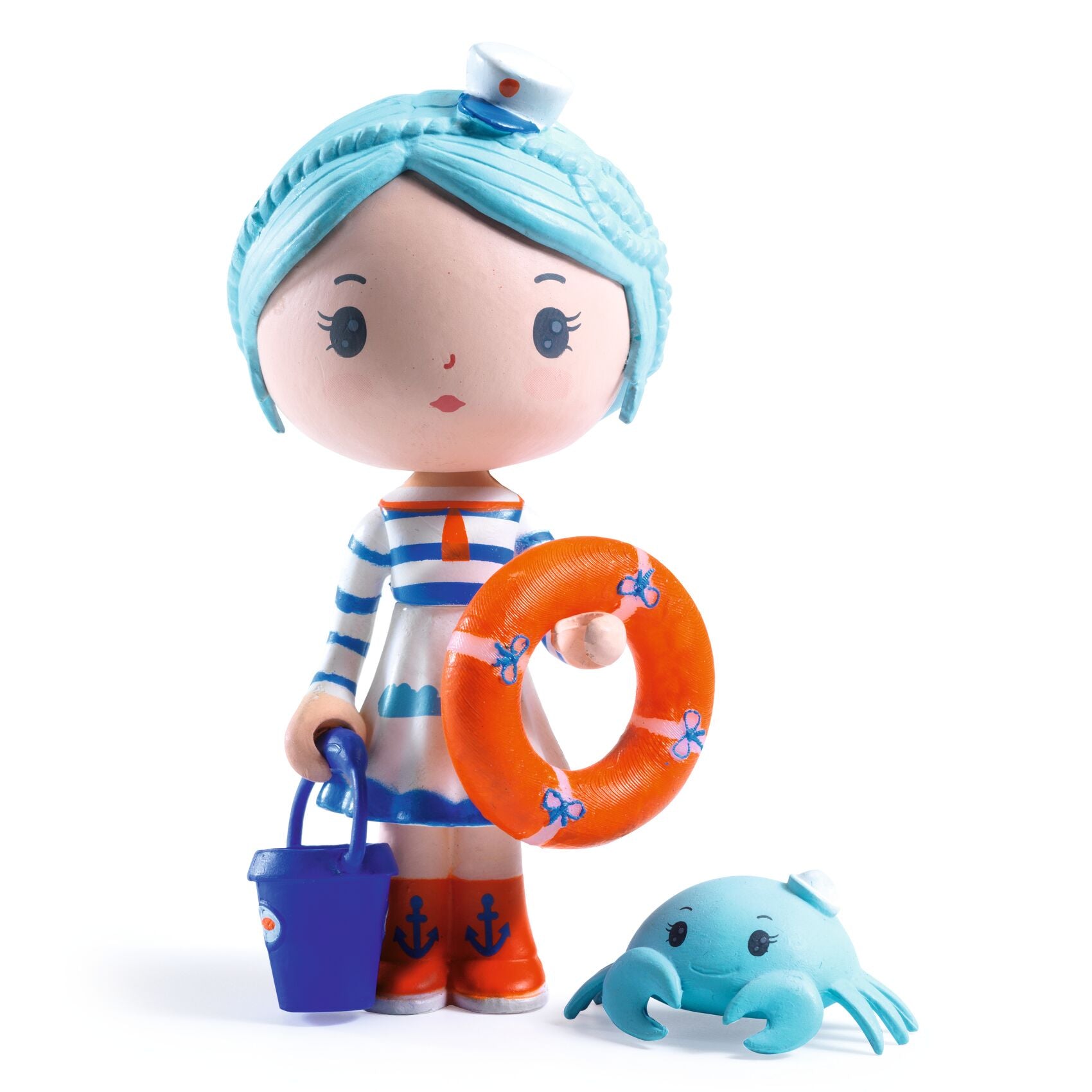 Toy figure of a character with blue hair, striped shirt, an orange lifebuoy and a small crab on a white background