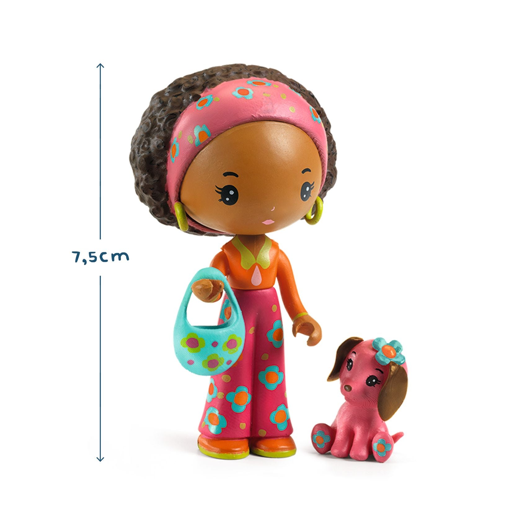 Toy figure of a girl with a dog, wearing colorful clothing and accessories, with a measurement label indicating a height of 7.5cm.