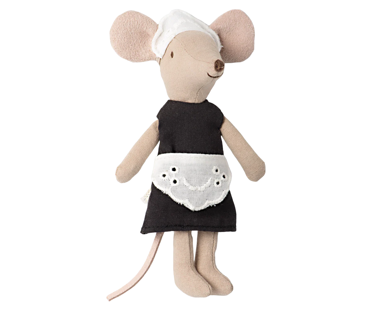 Stuffed mouse toy wearing a black dress with a white apron on a white background