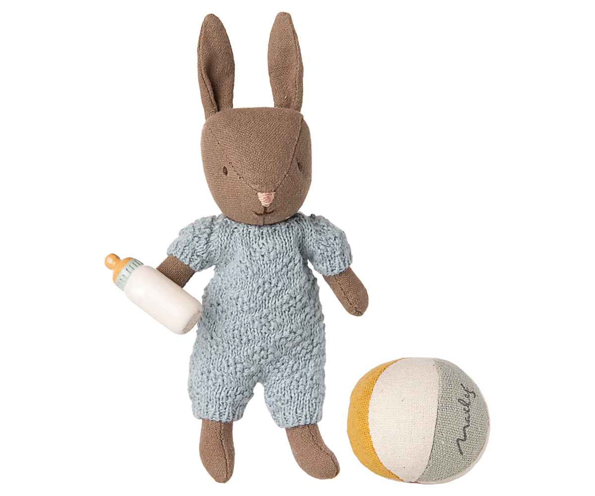 Maileg Stuffed rabbit toy in a blue outfit with a bottle and ball on a white background