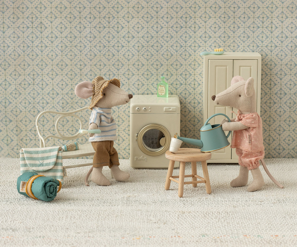 Maileg Big sister mouse in a matchbox, magnetic hands holding a watering can in a dolls house scene