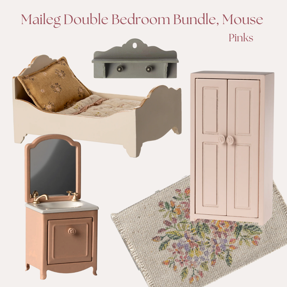 Miniature dollhouse furniture set including a bed, dresser, mirror, and cabinet on a floral rug.