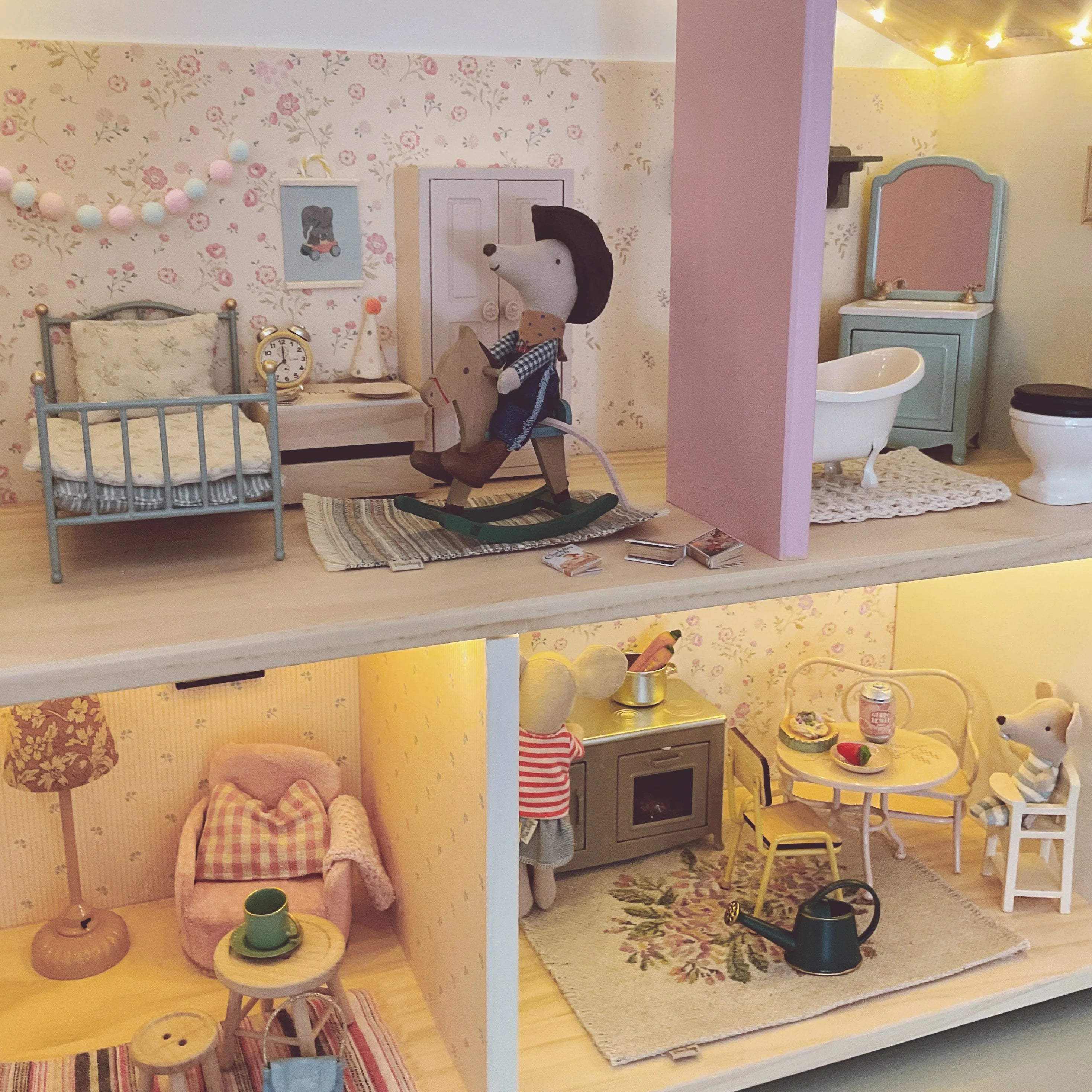 Detailed dollhouse with miniature furniture and decor