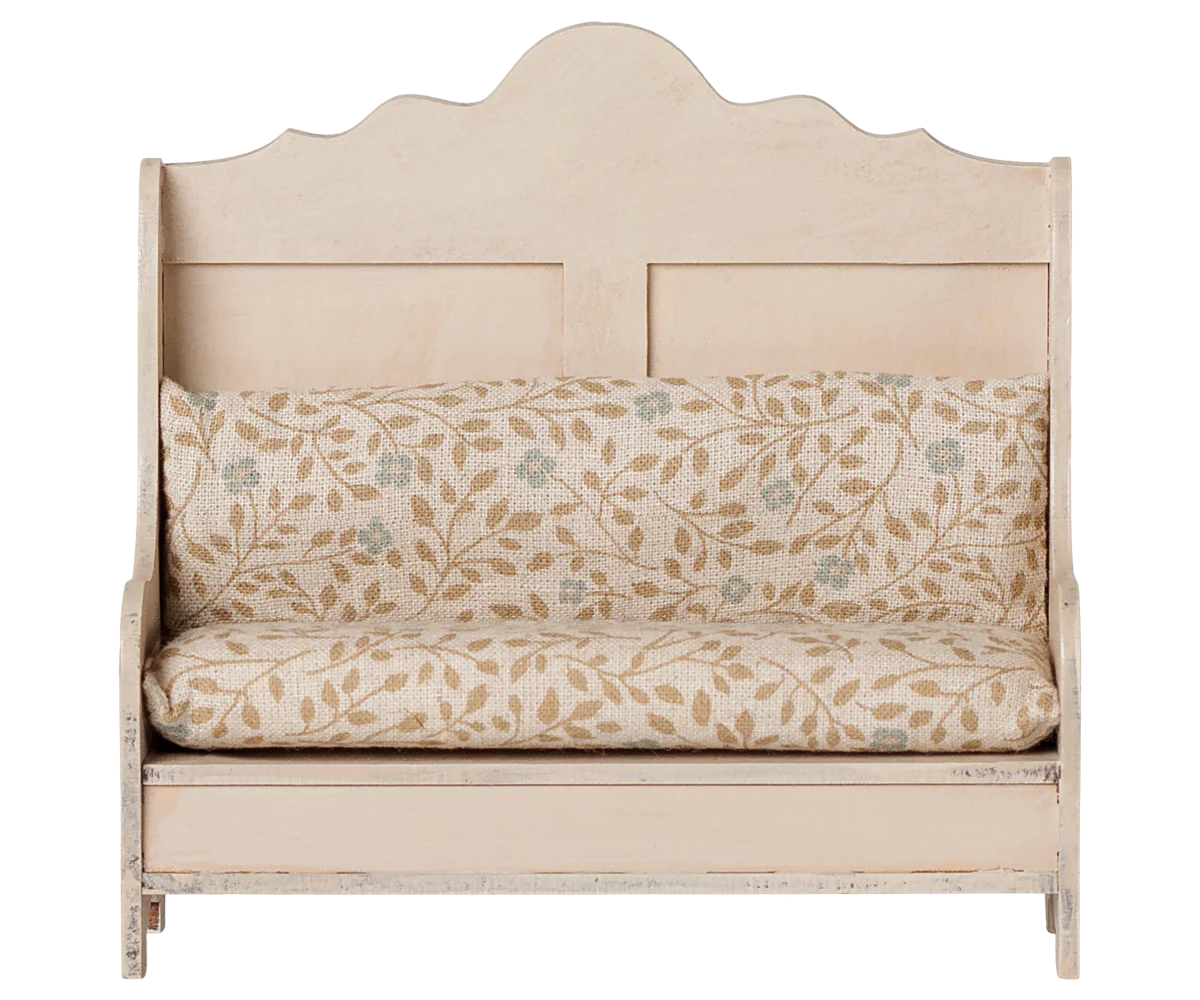 A rustic wooden bench with a distressed cream finish and a matching floral patterned cushion set, shown against a plain white background.