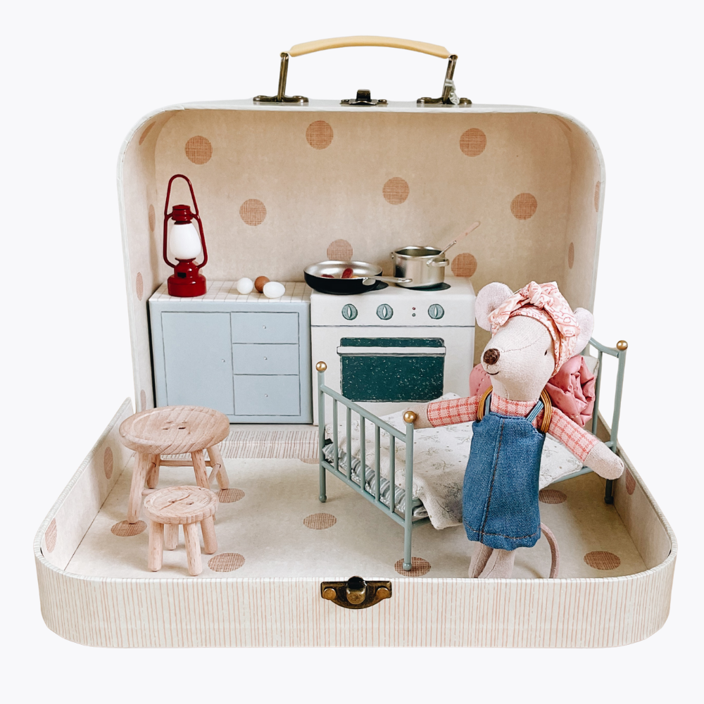 Miniature toy kitchen set inside a suitcase with a mouse character.