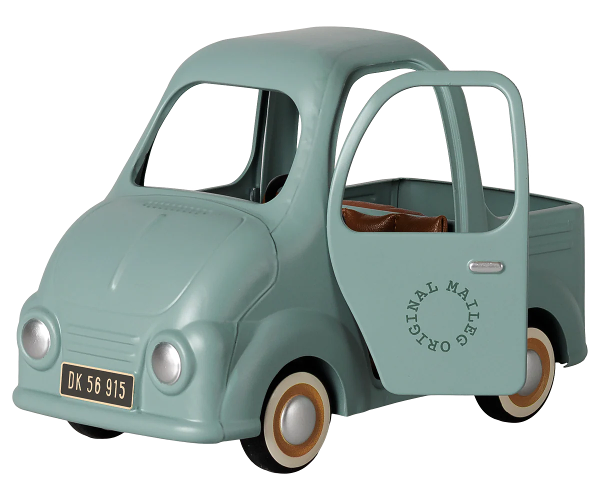 A mint green toy pickup truck styled like a classic Fiat 500, featuring an open door with 'ORIGINAL MAILER' printed on it, set against a plain white background.