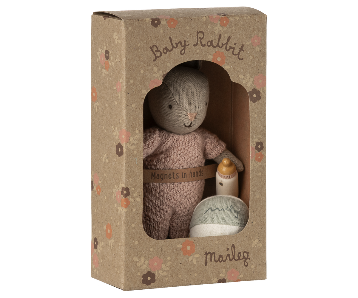 Knitted baby rabbit toy in a decorative box with 'Maileg' branding.