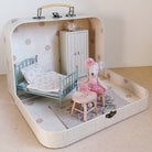 Maileg mouse Toy bedroom set inside a suitcase with bed, chair, and clock.