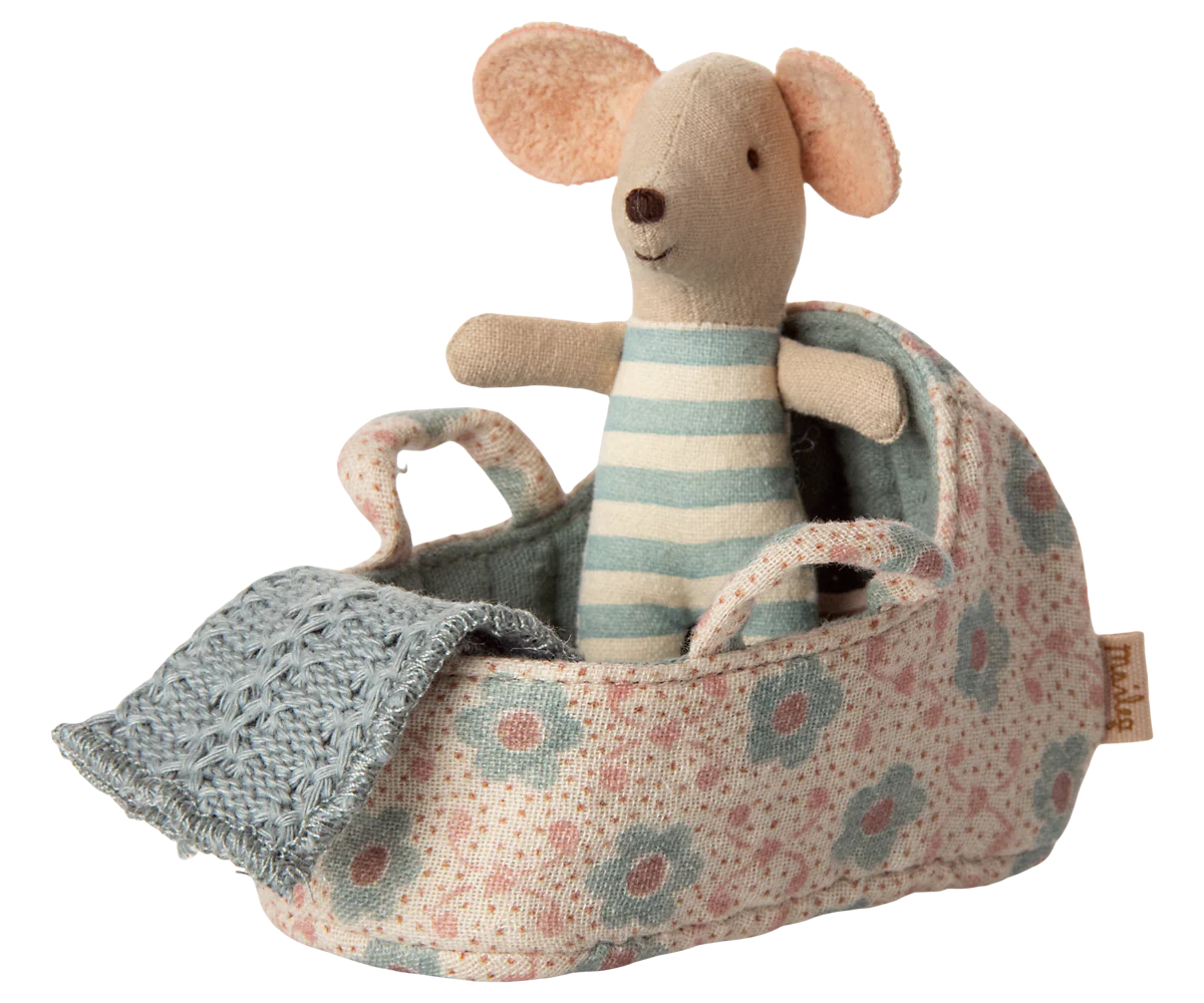 Stuffed Maileg mouse toy in a floral baby carriage with a blue blanket on a white background