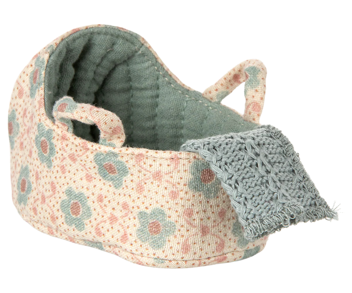 Maileg miniature Floral-patterned baby mouse carrycot with a textured blanket on a white background