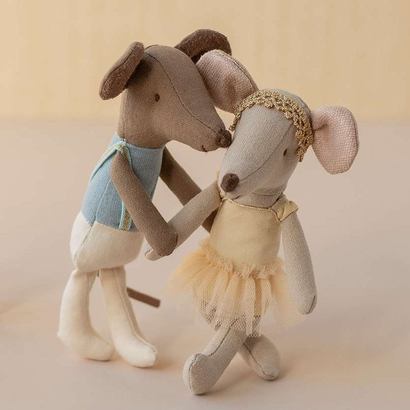 Two Maileg ballerina mice and a chair on a neutral background