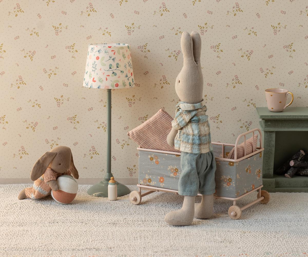 Maileg cot bed with rabbits in a bedroom