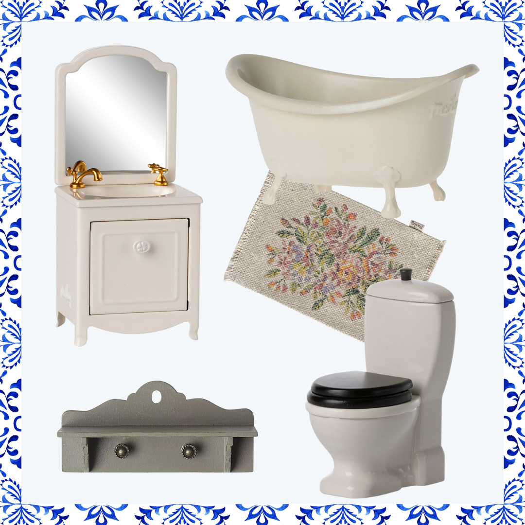 Bathroom furniture set including a vanity, bathtub, toilet, and cabinet on a decorative border.