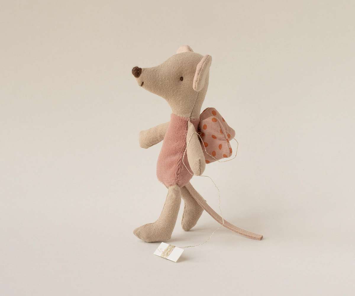Stuffed Maileg fairy mouse toy with a pink dress on a white background