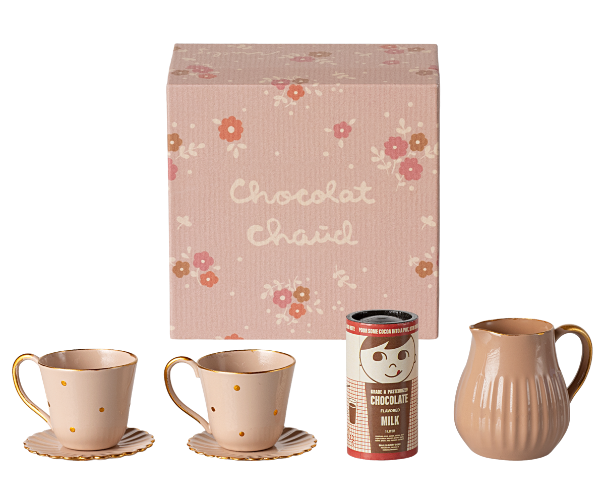 A Maileg hot chocolate set including two cups, two plates, a pot, and a box of chocolate with floral patterned wrapping.