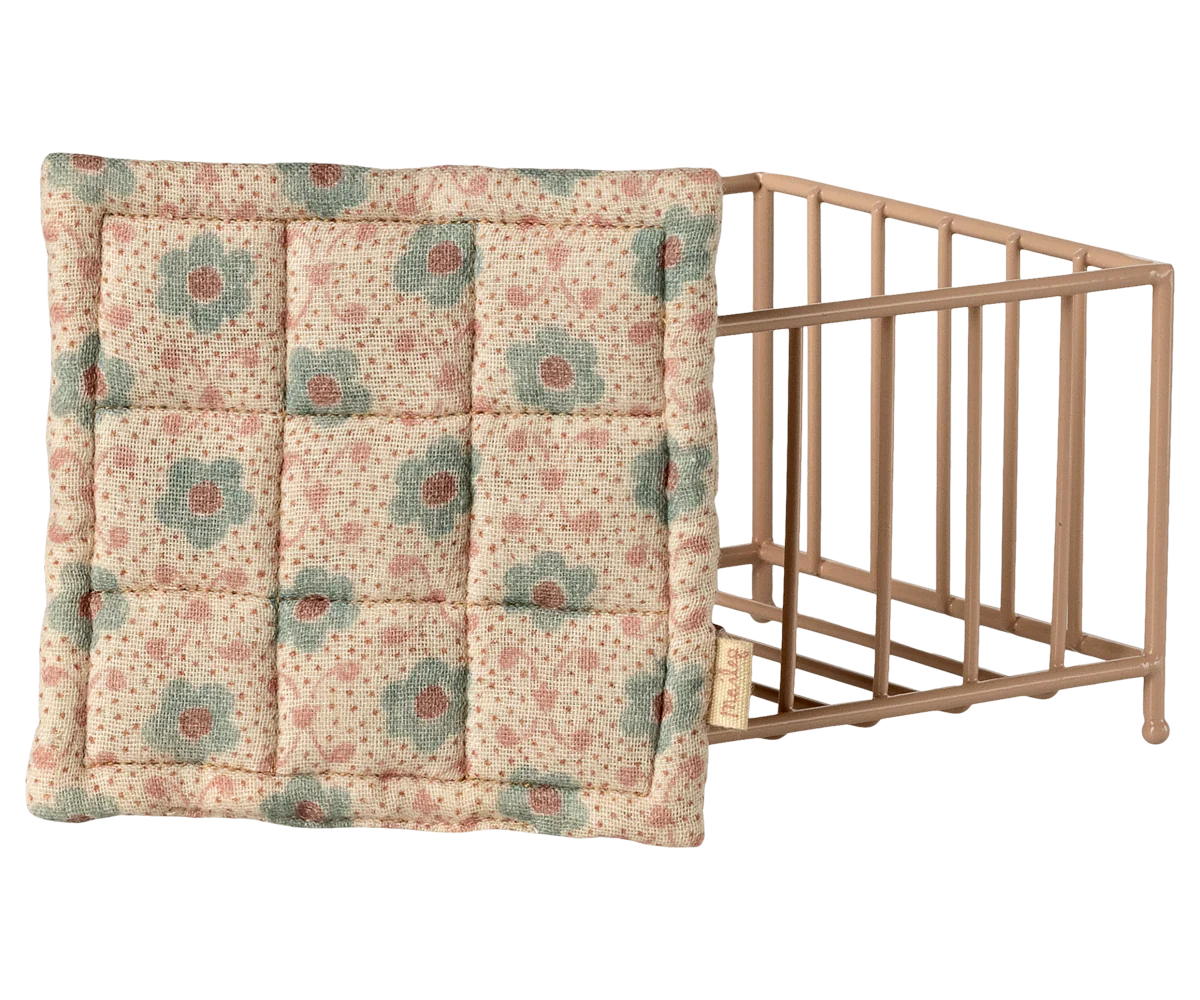 Maileg playpen, baby mice - Rose Floral-patterned quilt draped over a baby crib on a white background