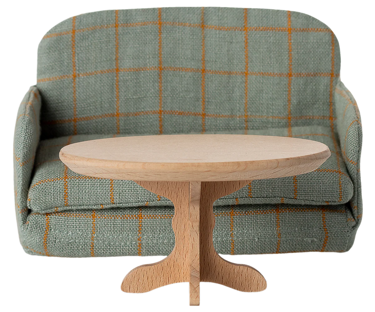 Maileg Green sofa bed with a wooden table in front