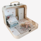 Miniature dollhouse inside a suitcase with maileg mouse, furniture and decor.