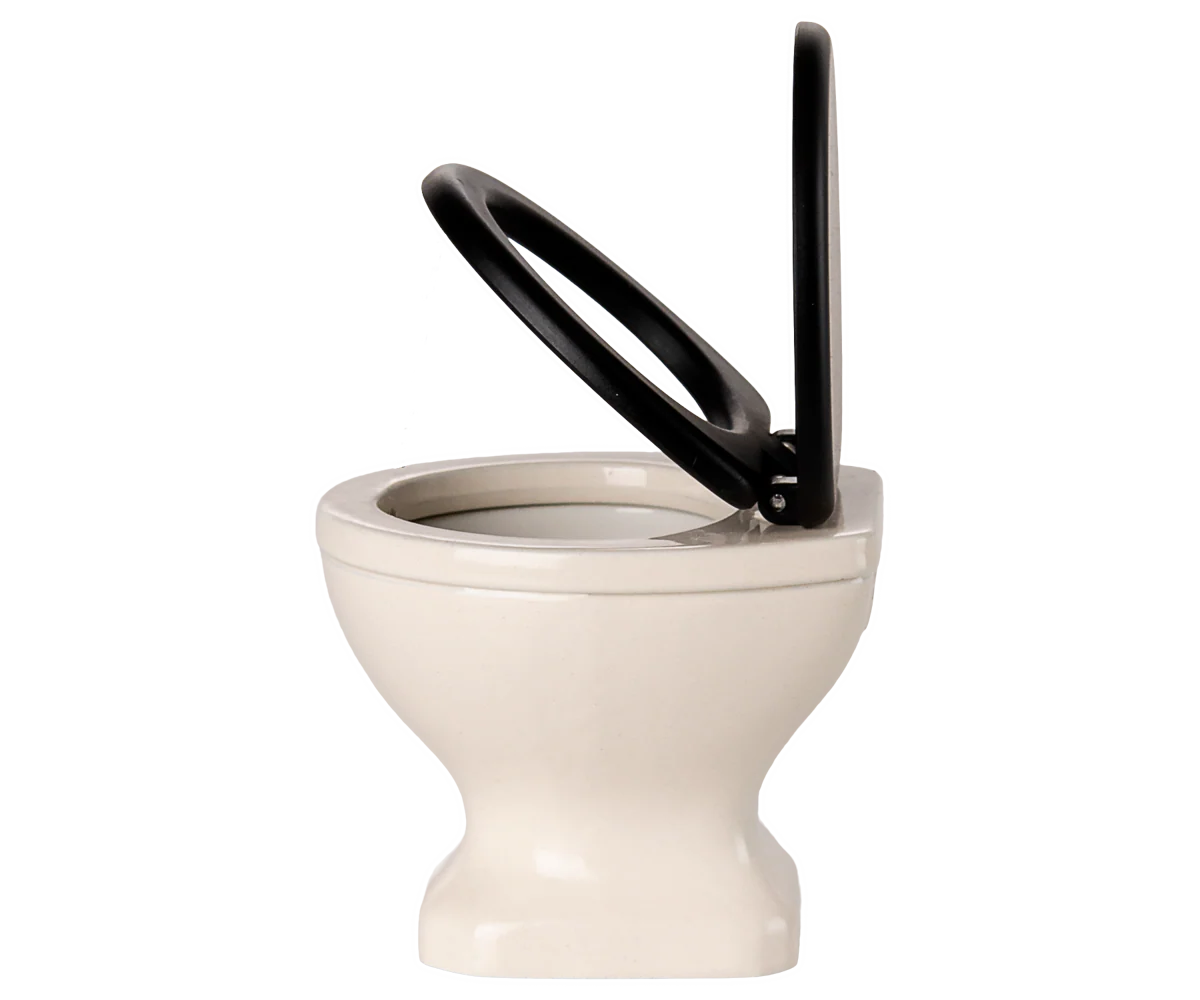 Maileg toy White ceramic toilet with black seat and handle on a white background