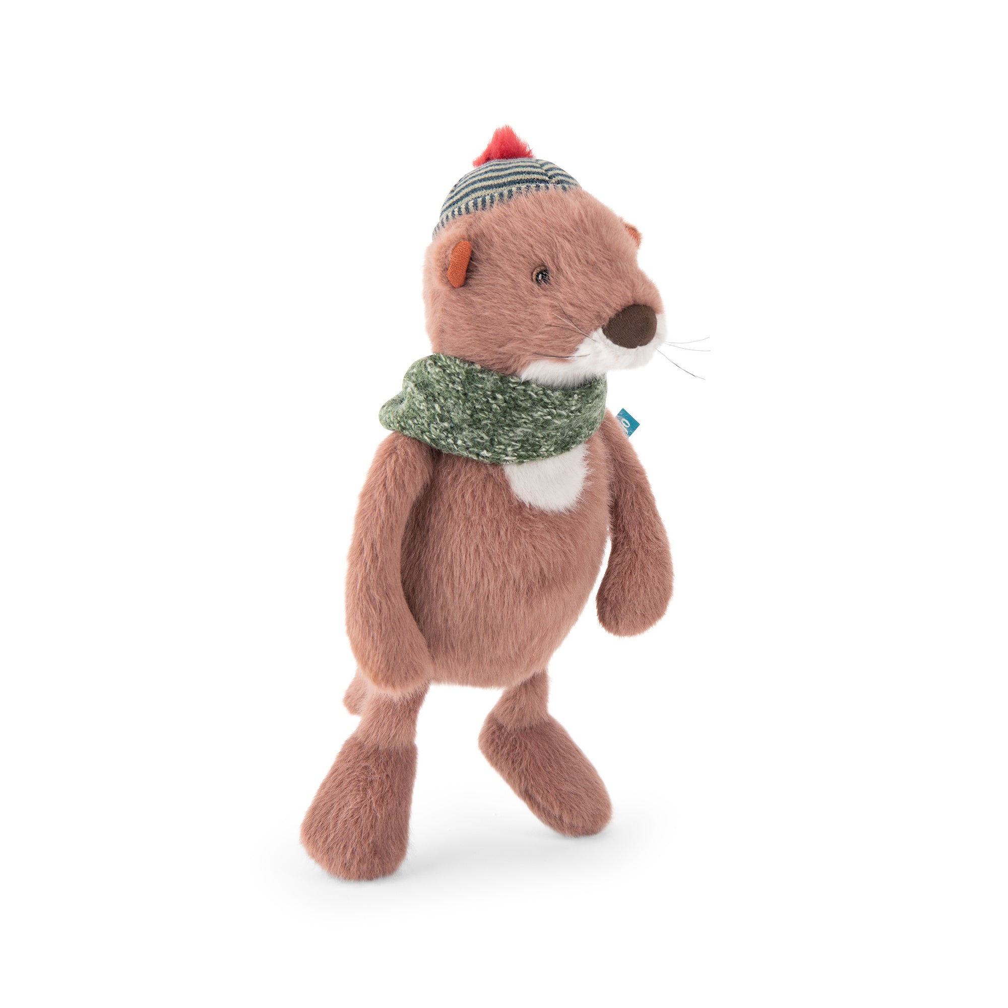 A plush toy otter wearing a green knit scarf and a striped beanie with a red pom-pom, standing against a plain white background.