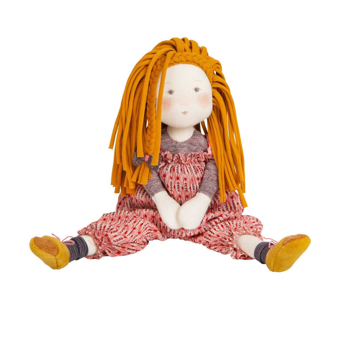 Plush toy with orange hair and a pink dress on a white background