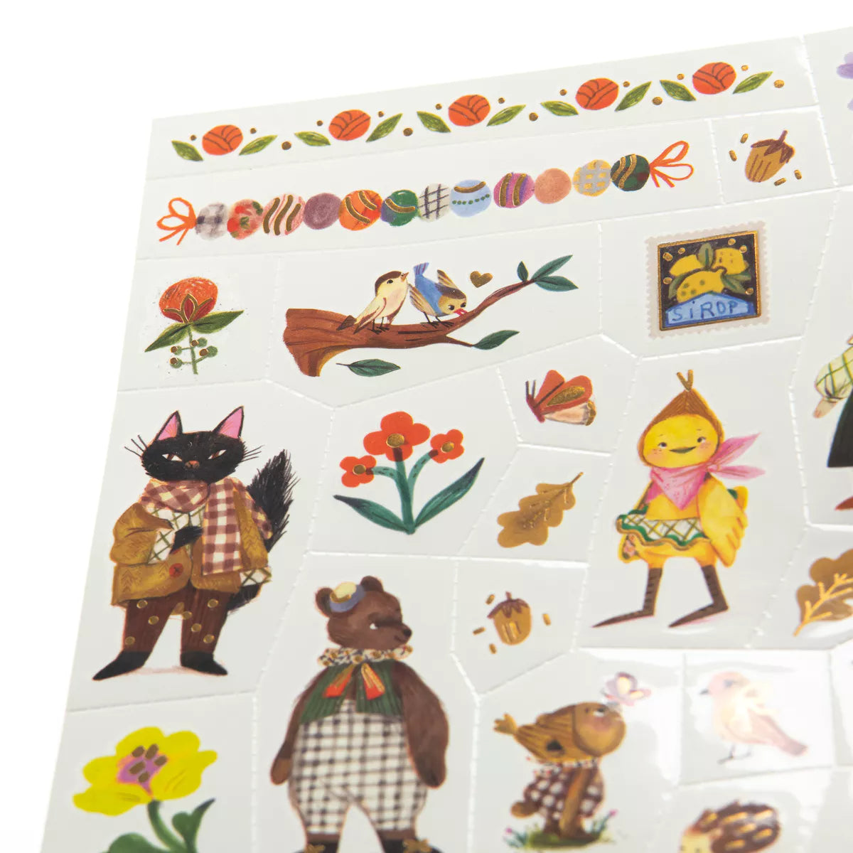 Sheet of illustrated temporary tattoos for children featuring animals, plants, and a duck called Rita.