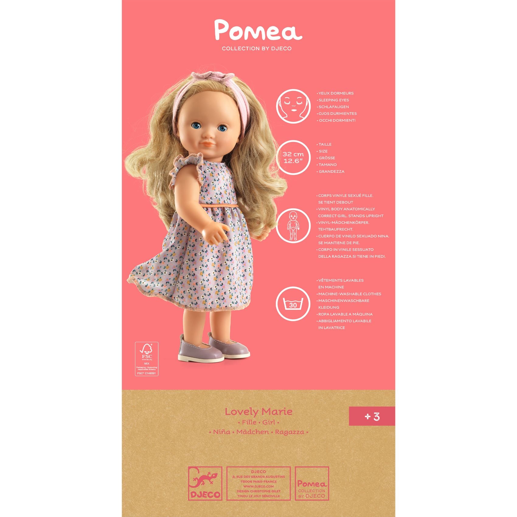 Doll packaging with a doll and product details on a pink background