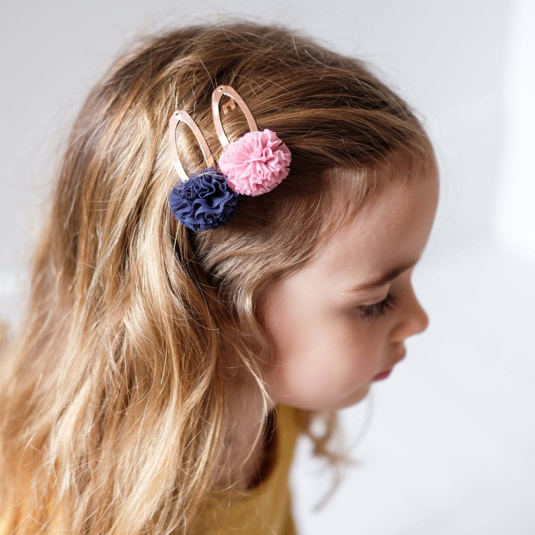 Girl wearing Mimi and Lula hair clips