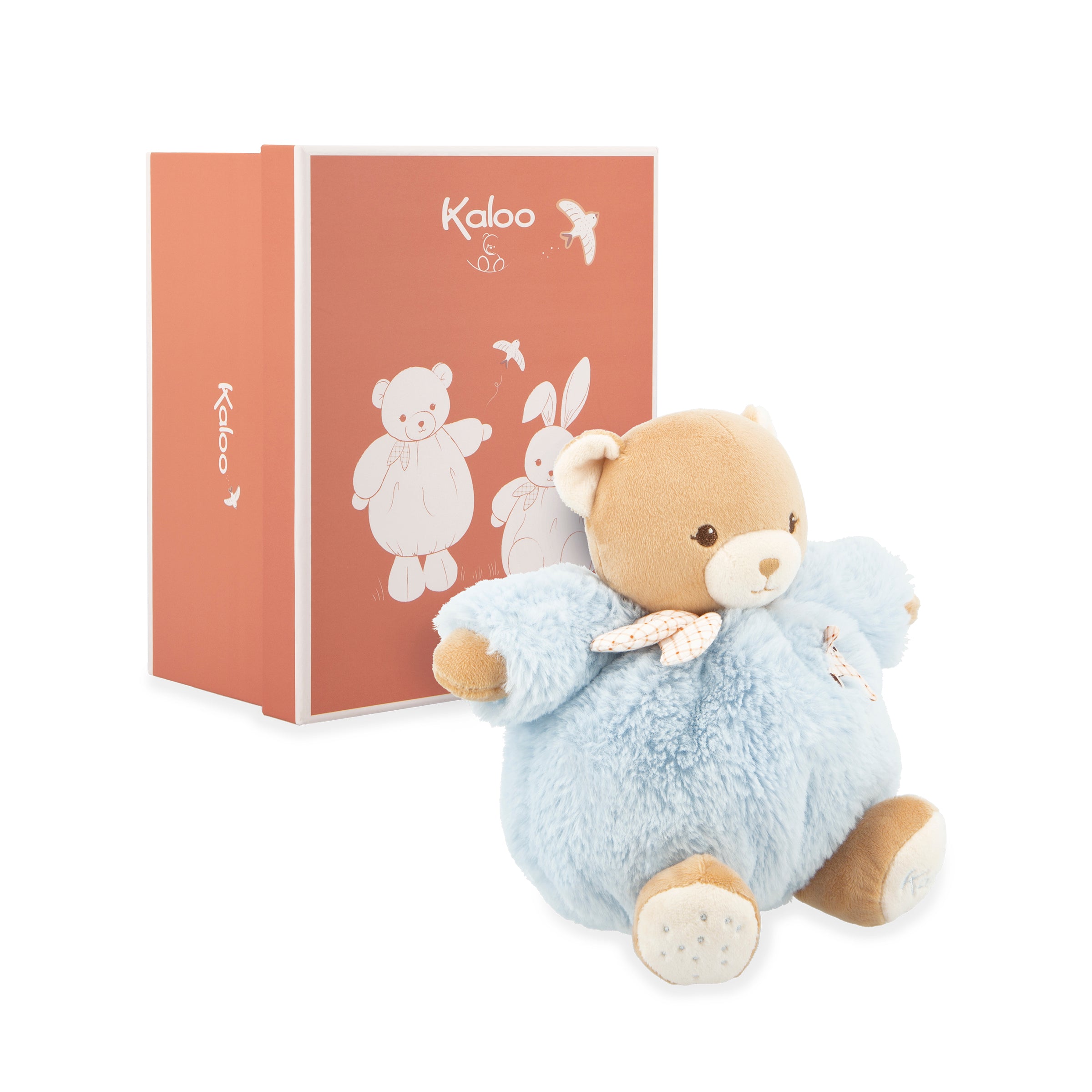 Plush teddy bear in a blue outfit with a pink box featuring the brand 'Kaloé' on a white background.
