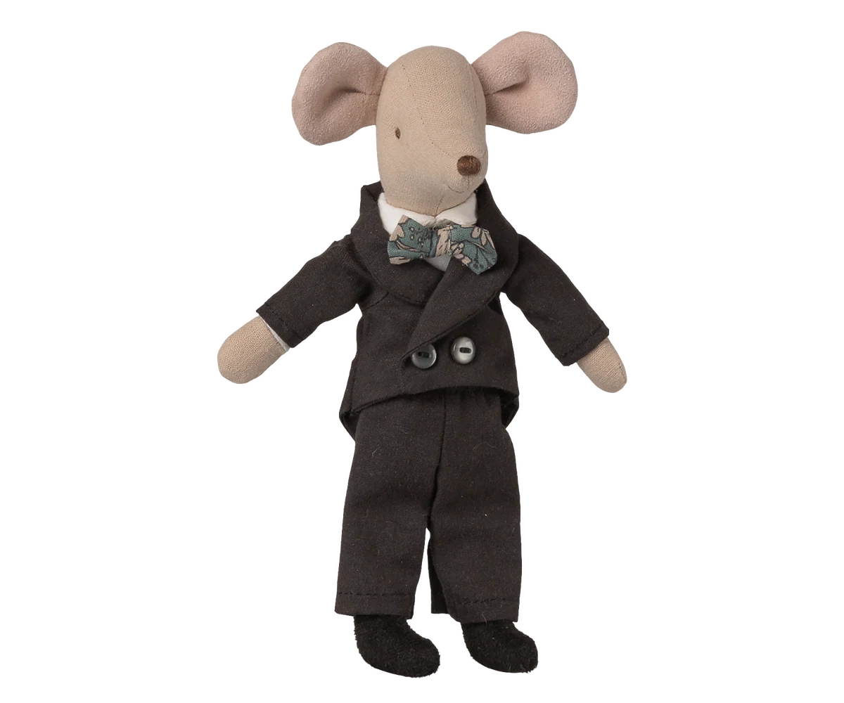 Stuffed toy mouse in a dark suit with a bow tie on a white background