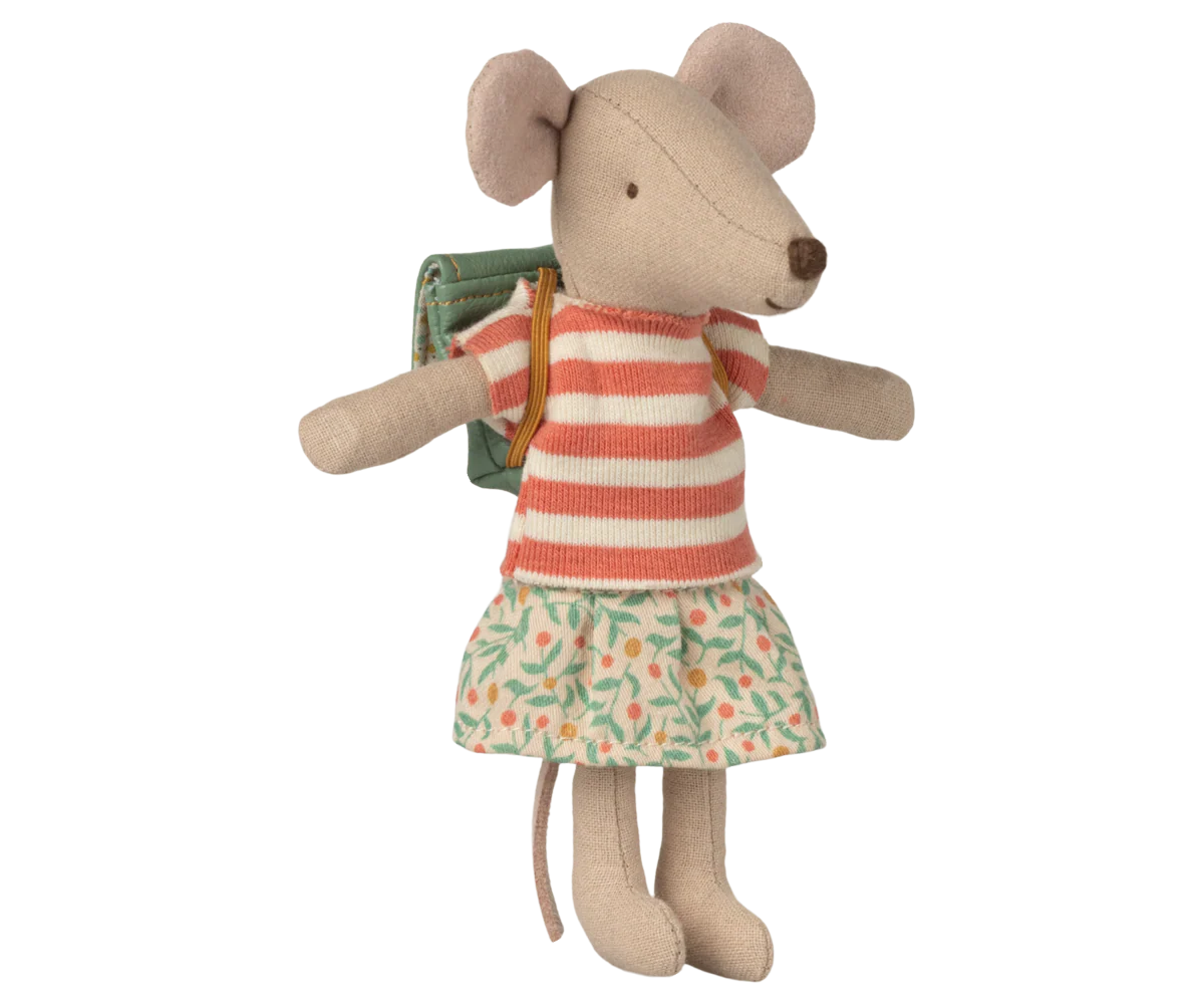Stuffed Maileg mouse toy wearing a striped dress and holding a book on a white background