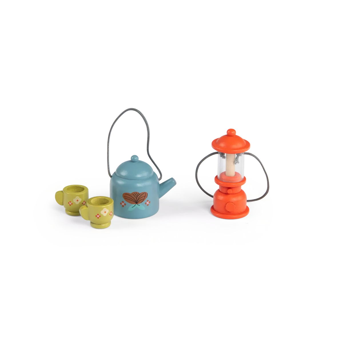 Miniature tea set with teapot, cups, and lantern on a white background