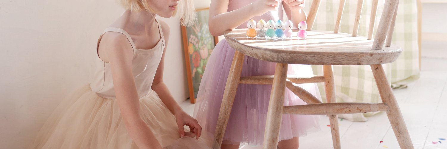 Two girls dressed in Bob and Blossom party dresses