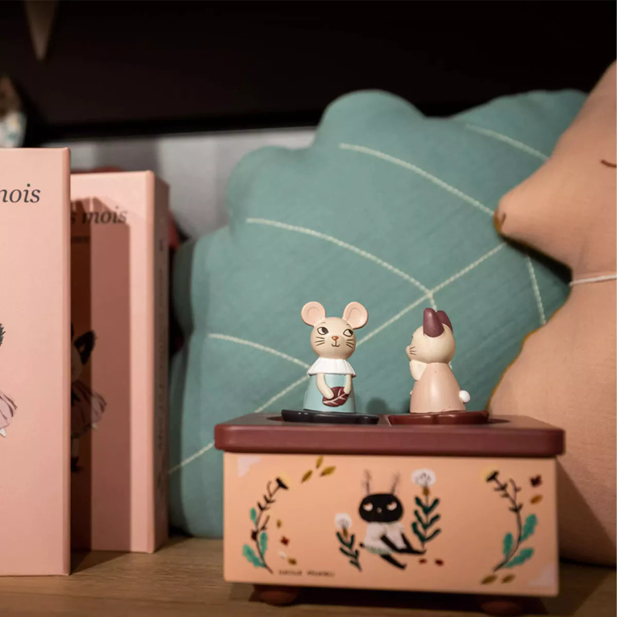 Music box with two mouse figures on a shelf