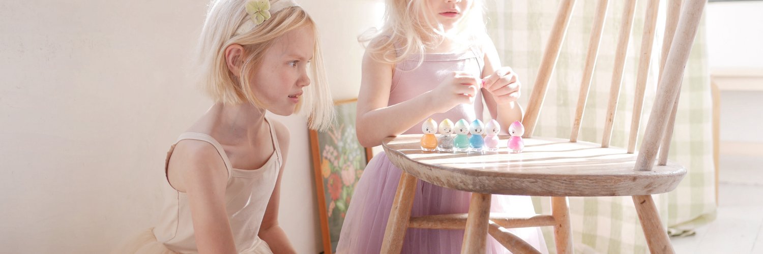 two girls wearing Bob and Blossom party dresses