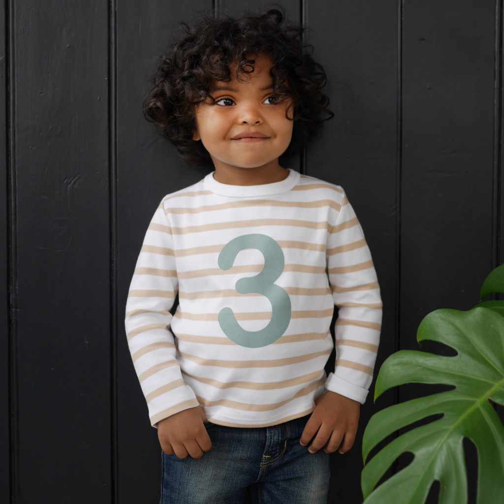 Child wearing a Bob and Blossom number 3 breton striped T shirt 