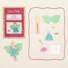 Fairy peg doll kit with packaging, clothespin, and accessories on a beige background