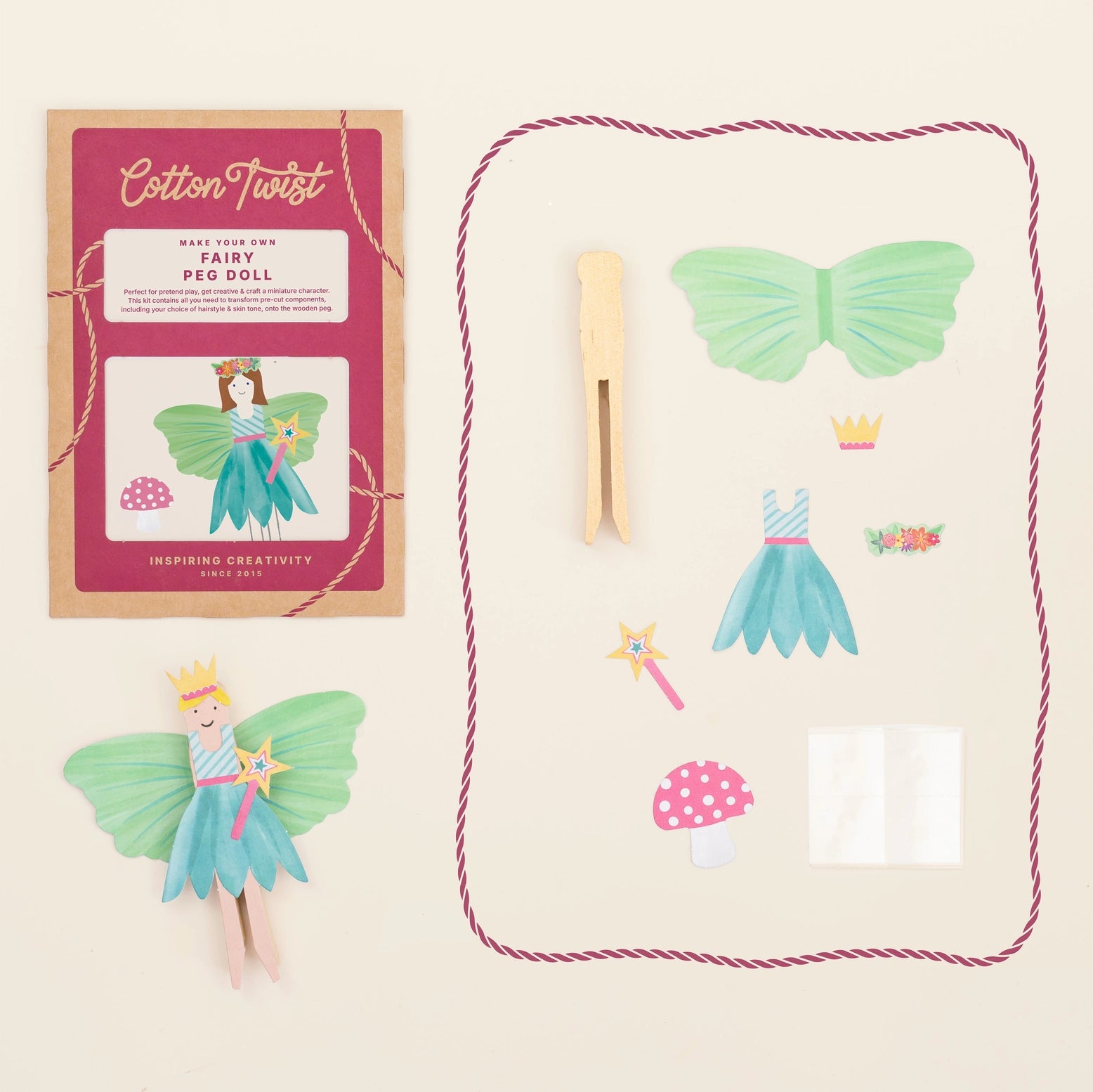 Fairy peg doll kit with packaging, clothespin, and accessories on a beige background