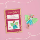 Fairy peg doll kit with packaging on a pink background